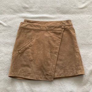 Brown leather mini skirt, wraps around the waist, size 26. Worn once!